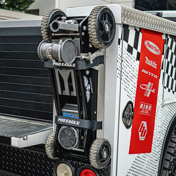 3 Ton Kratos Jack Mount 2.0 attached to a vehicle's rear with labels and tools displayed.